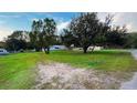 View of a spacious front yard with mature trees adding shade and character to the property at 4805 1St Nw St, Lakeland, FL 33810