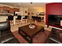 Cozy living room featuring a comfortable sofa, coffee table, and adjacent dining area at 8984 Cuban Palm Rd, Kissimmee, FL 34747