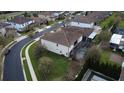 A bird's-eye view of a home with a screened-in pool and spacious backyard in a residential area at 10902 Citron Oaks Dr, Orlando, FL 32836