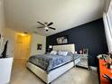 Comfortable main bedroom with stylish decor, a ceiling fan, and neutral tones, creating a cozy retreat at 1966 Derby Glen Dr, Orlando, FL 32837