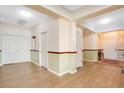 Bright entryway featuring hardwood floors, neutral paint, and multiple doorways for easy access at 3452 Goldeneye Ln, St Cloud, FL 34772