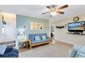 Bright living room features a ceiling fan, stairs to the second level, and wood-look flooring at 3741 Crossing Creek Blvd, St Cloud, FL 34772