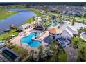 Aerial view showcasing a resort-style pool and waterpark in the community at 4807 Kings Castle Cir, Kissimmee, FL 34746