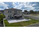 Spacious backyard featuring a paved patio area with gazebo, perfect for outdoor entertaining at 953 Cambridge Dr, Winter Haven, FL 33881