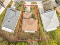 Aerial view displaying the house and its lot, highlighting the yard size and proximity to neighboring homes at 10409 Laxton St, Orlando, FL 32824