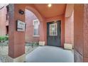 Covered entryway with intercom system and black door at 107 Vista Verdi Cir # 129, Lake Mary, FL 32746