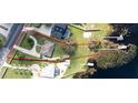 Aerial view of property boundaries, house, dock, waterfront access, and surrounding neighborhood at 10919 Lakeshore Dr, Clermont, FL 34711