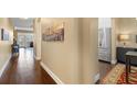 Long hallway that leads into a large living room with views into the kitchen at 1221 Olmstead Blvd # 214, Celebration, FL 34747