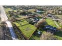 Aerial view of the property surrounded by a red boundary, showcasing the landscaping at 15350 Arabian Way, Montverde, FL 34756