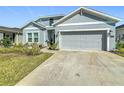 Charming home featuring a well-manicured front yard, and a two-car garage at 281 Piave St, Haines City, FL 33844