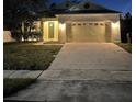 Charming one-story home featuring a two-car garage and well-maintained lawn at 3470 Goldeneye Ln, St Cloud, FL 34772