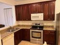 Kitchen boasting sleek stainless steel appliances and granite countertops at 3470 Goldeneye Ln, St Cloud, FL 34772