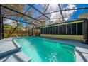 Inviting screened-in pool area with clear water and a covered seating space at 4318 Oak Ct, St Cloud, FL 34769