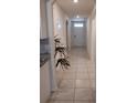 Inviting tiled entryway featuring arched doorways, leading into various rooms of the home, with a house plant accent at 5295 Timberland Ave, St Cloud, FL 34771