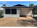 Backyard includes a wooden deck with geometric tiling and exterior lighting at 610 Illinois Ave, St Cloud, FL 34769