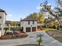 A detached garage apartment features a two-car garage, living space and balcony at 802 S 10Th St, Haines City, FL 33844