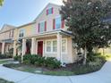 Inviting townhome with a cozy front porch and well-maintained garden at 10210 Hartford Maroon Rd, Orlando, FL 32827