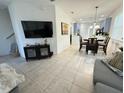 Open-concept living area leading into a dining space and kitchen at 10210 Hartford Maroon Rd, Orlando, FL 32827