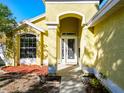 Close-up of the front entrance showcasing a decorative glass door and well-kept landscaping details at 12622 Earnest Ave, Orlando, FL 32837