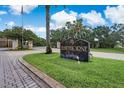 The beautiful Hawthorne Village community sign, surrounded by lush landscaping at 2416 Swailes Dr # 8, Orlando, FL 32837