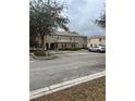 Exterior view of a multi-Gathering residence with dedicated resident parking at 2894 Tanzanite Ter, Kissimmee, FL 34758