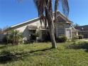 View of the side of the home showing the bay window and the lawn at 414 Otter Creek Dr, Kissimmee, FL 34743