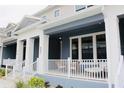 Relaxing front porch with cozy seating, offering a tranquil outdoor living space at 452 Diamond Dove Cv, Winter Springs, FL 32708