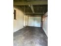 Spacious garage featuring an overhead light and functional door at 6144 Shenandoah Way, Orlando, FL 32807