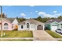 Charming single-story home featuring a well-maintained lawn and driveway at 6921 Long Needle Ct, Orlando, FL 32822