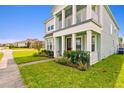 Inviting exterior with a covered porch and lush landscaping at 2800 Cello Ln, Kissimmee, FL 34741