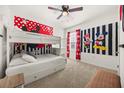 Fun bedroom with playful Mickey Mouse themed decor and bunk beds at 5117 Oakbourne Ave, Davenport, FL 33837