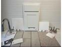 Interior design samples featuring tiling, flooring, cabinets, and a stainless steel faucet at 5457 Catmint Dr, Lake Hamilton, FL 33851