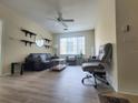 Inviting living room with laminate floors, stylish décor, and ample natural light at 8137 Claire Ann Dr # 203, Orlando, FL 32825