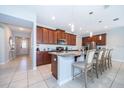 Spacious kitchen with granite countertops, stainless appliances and breakfast bar with seating at 1737 Caribbean View Ter, Kissimmee, FL 34747