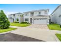 Beautiful two-story home featuring a lovely front yard and a two car garage at 194 Golden Noble St, Davenport, FL 33897