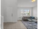 Bright living room with large window and modern furniture at 194 Golden Noble St, Davenport, FL 33897
