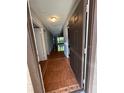 Hallway features beautiful tile flooring and a view of the bright, airy living spaces at 2900 S Semoran Blvd # S, Orlando, FL 32822