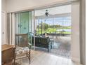 View from living room of screened lanai, complete with brick floor and outdoor dining area at 4311 Via Cavour Ct, Kissimmee, FL 34759