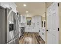 Bright kitchen features stainless appliances, white cabinets, subway tile backsplash at 628 Eastwood Ct, Altamonte Springs, FL 32714