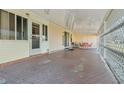 Spacious covered patio with outdoor seating, perfect for relaxing and entertaining at 6719 Canterbury Ne Dr, Winter Haven, FL 33881