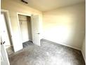 Neutral bedroom featuring carpet, a closet, and a bright, airy atmosphere at 1629 Ambar Ct, Winter Haven, FL 33881
