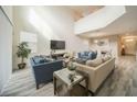 Spacious living room featuring high ceilings, comfortable seating, and a large TV at 1646 Moon Valley Dr, Davenport, FL 33896