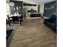 Open concept living room featuring modern design, dining area, and updated kitchen at 1664 Redfin Dr, Kissimmee, FL 34759