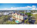 Beautiful exterior shot of a hotel with a pool at 3000 Maingate Ln # 424, Kissimmee, FL 34747