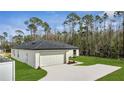A cozy home with a two-car garage and well-maintained landscaping at 41 Peterlee Ct, Kissimmee, FL 34758