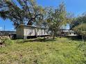 A single-story house with a grassy backyard at 413 4Th St, Orlando, FL 32824