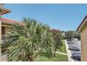 Aerial view from the balcony, overlooking the complex's parking and landscaped common area at 901 Charo Pkwy # 731, Davenport, FL 33897