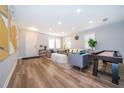 Bright and airy living room featuring modern decor and sleek, wood-look flooring at 1113 Pine Ridge Dr, Davenport, FL 33896