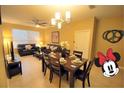 Cozy living and dining area perfect for entertaining, filled with natural light at 2305 Silver Palm Dr # 102, Kissimmee, FL 34747
