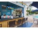 Poolside tiki bar with seating and resort style ammenities at 2305 Silver Palm Dr # 102, Kissimmee, FL 34747